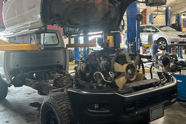 RAM truck being serviced with flat tappet conversion kit with body separated and on lift